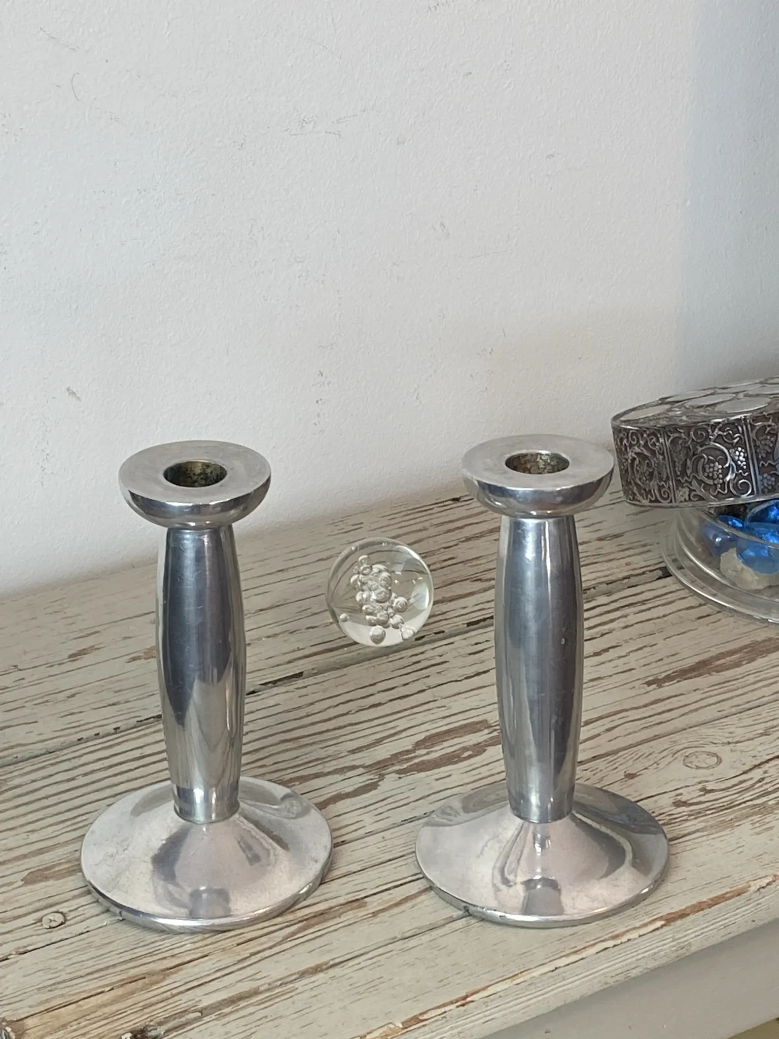 Pair of minimalist polished aluminium candle holders