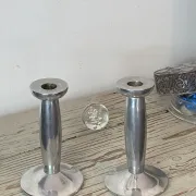Pair of minimalist polished aluminium candle holders