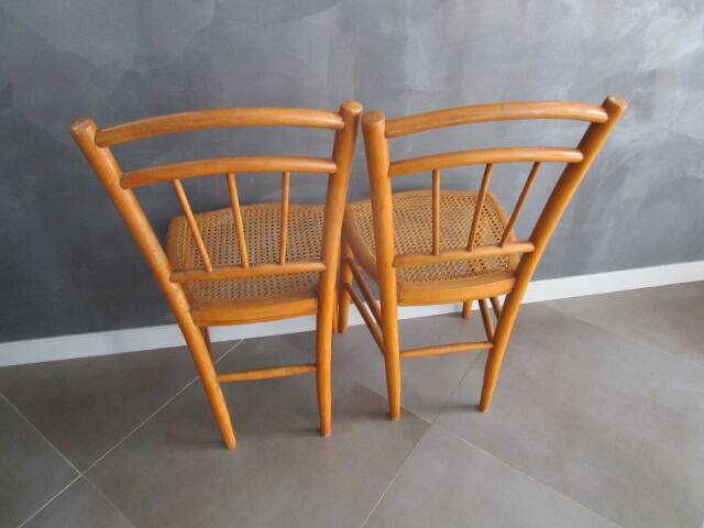 Pair of old caned chairs in blond wood
