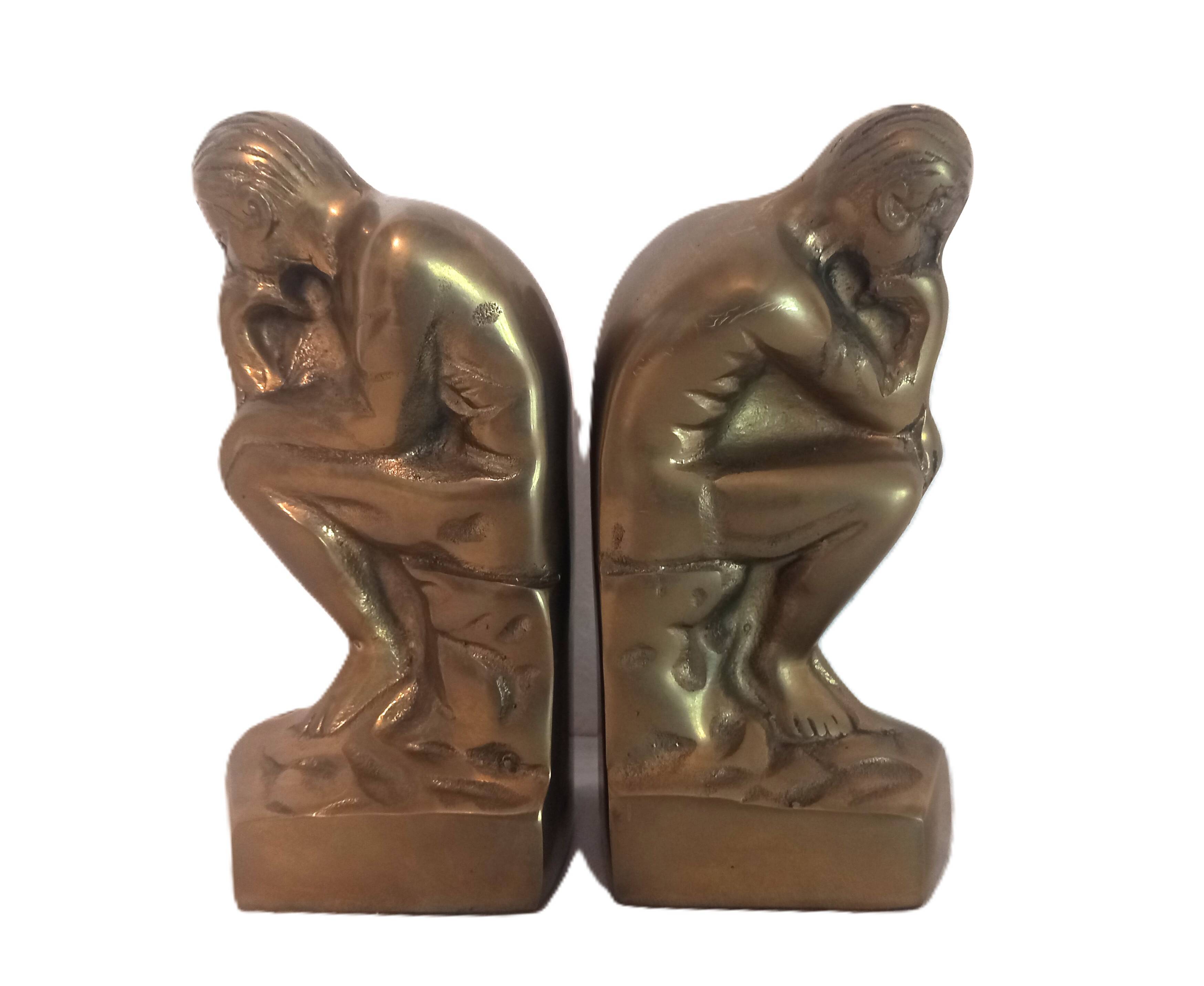 Pair of brass "thinker" bookends