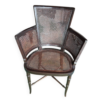 Cane armchair