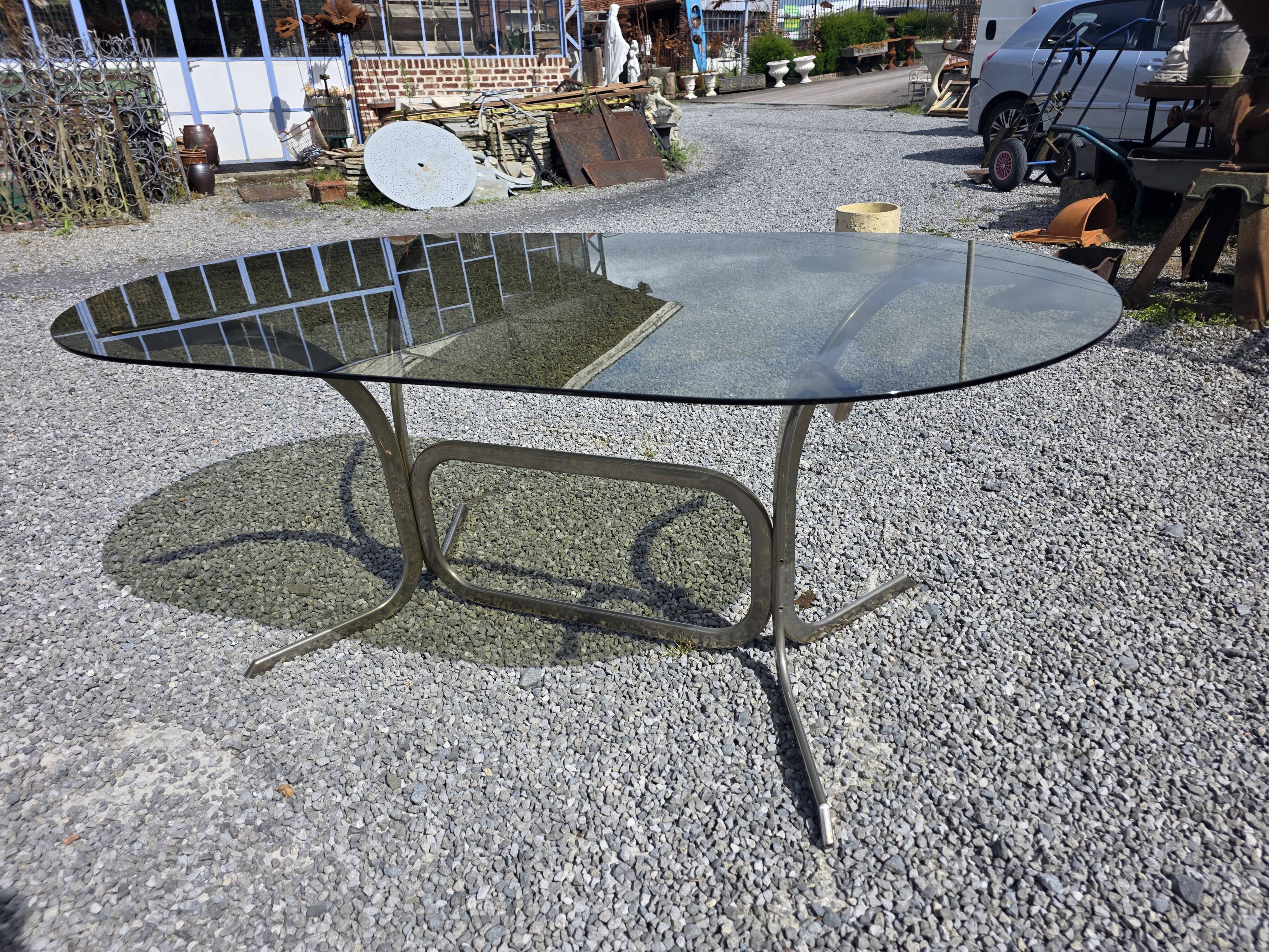Silver metal table with smoked glass top from the 1970s.