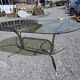 Silver metal table with smoked glass top from the 1970s.