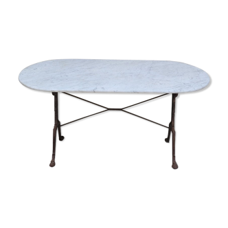 Restaurant bistro table in oval marble and decorated cast iron bases -1m51