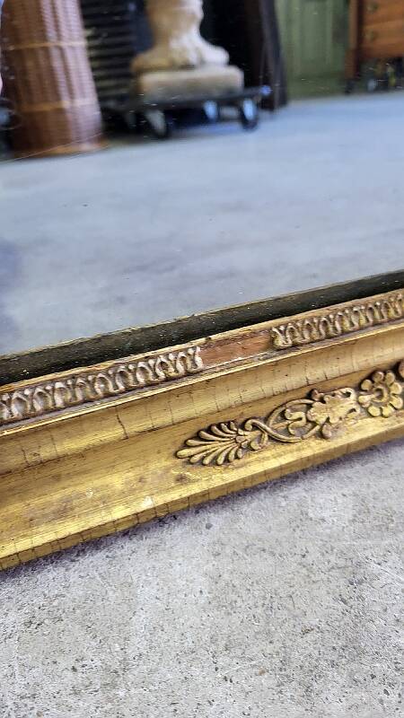 GOLDEN WOODEN MIRROR WITH PALMETTES FROM THE 19TH CENTURY