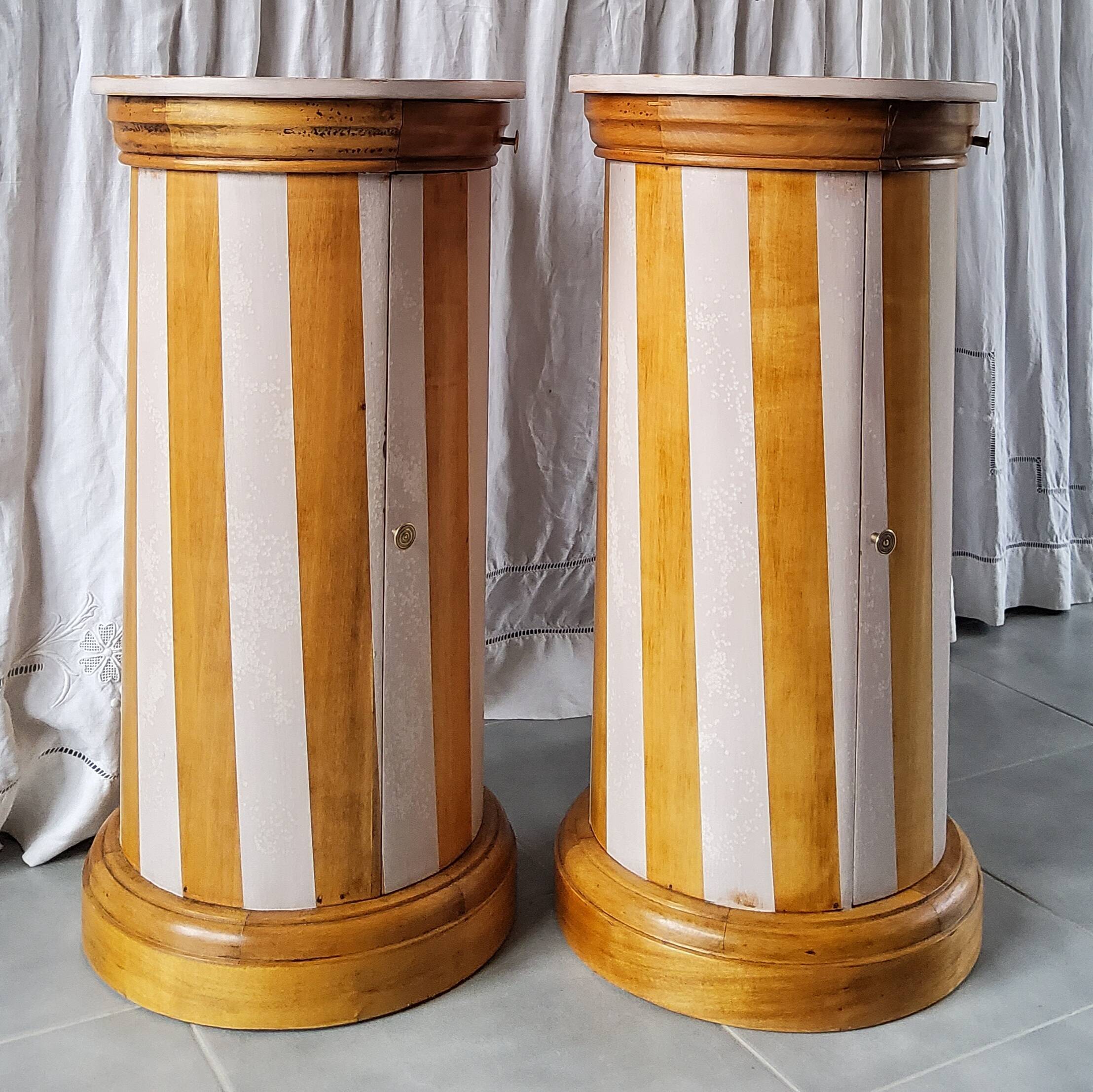 A pair of distressed bedside tables.