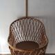 Vintage rattan cradle with its spire