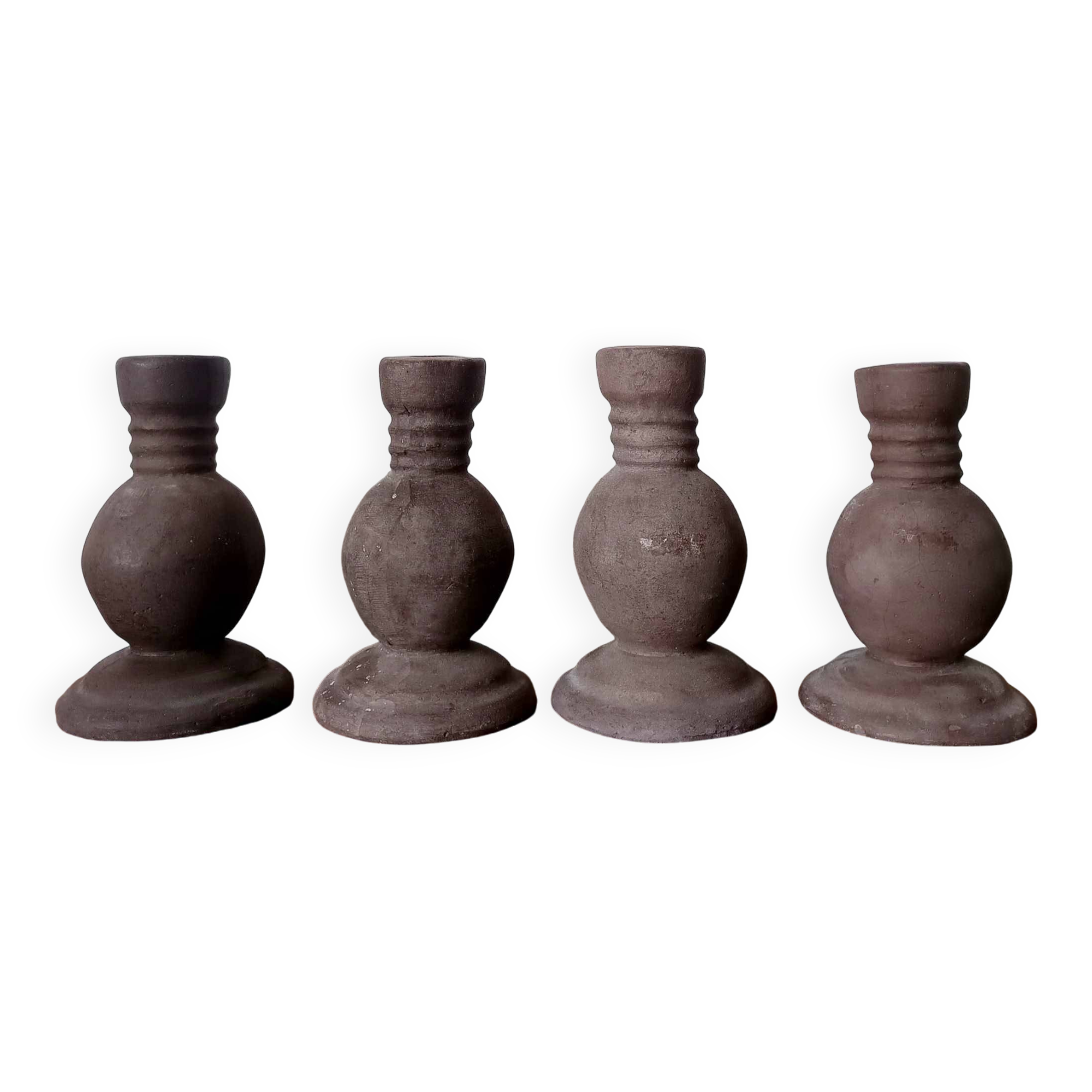 Four vintage handcrafted candle holders