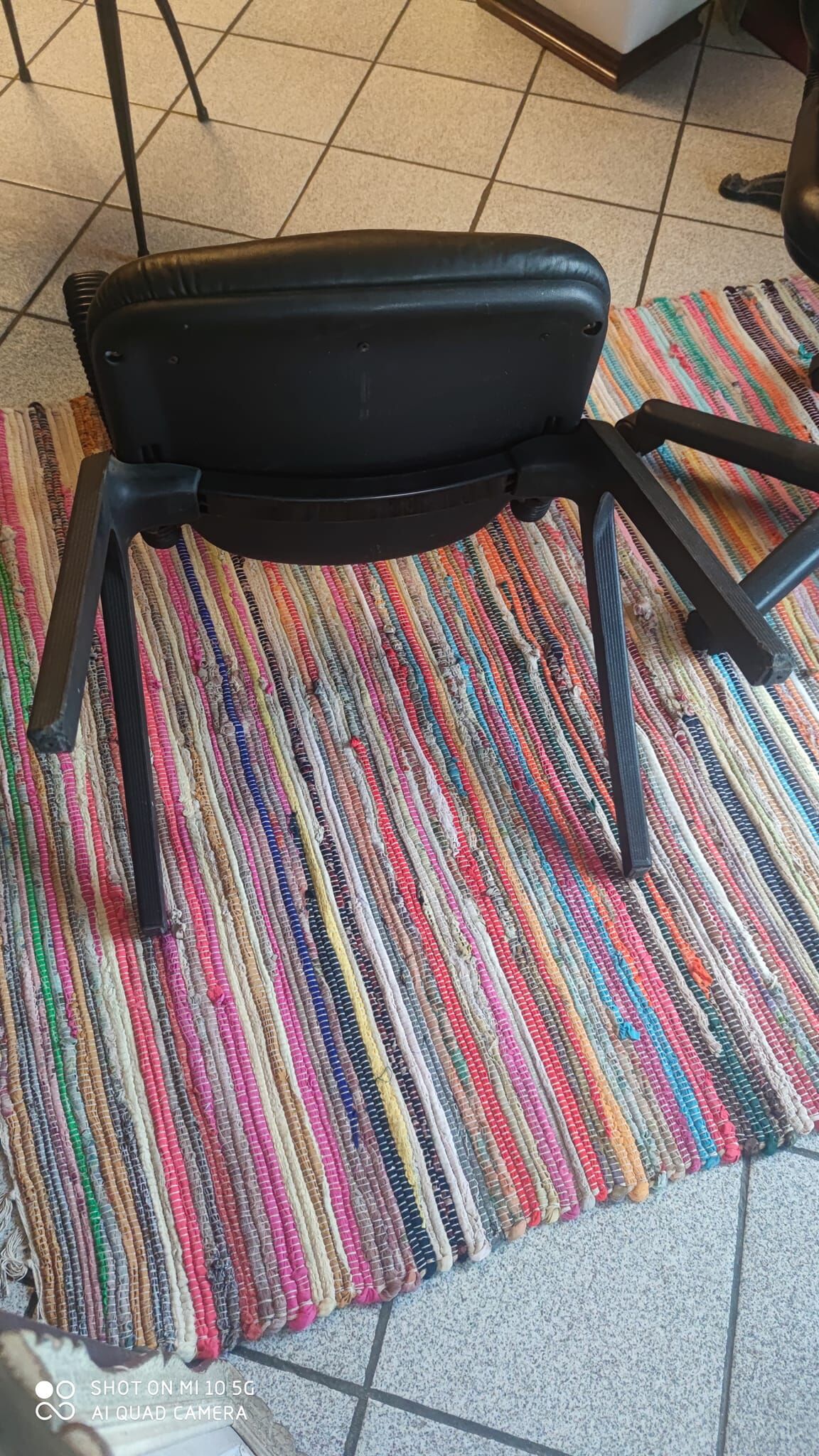 Two black leather armchairs