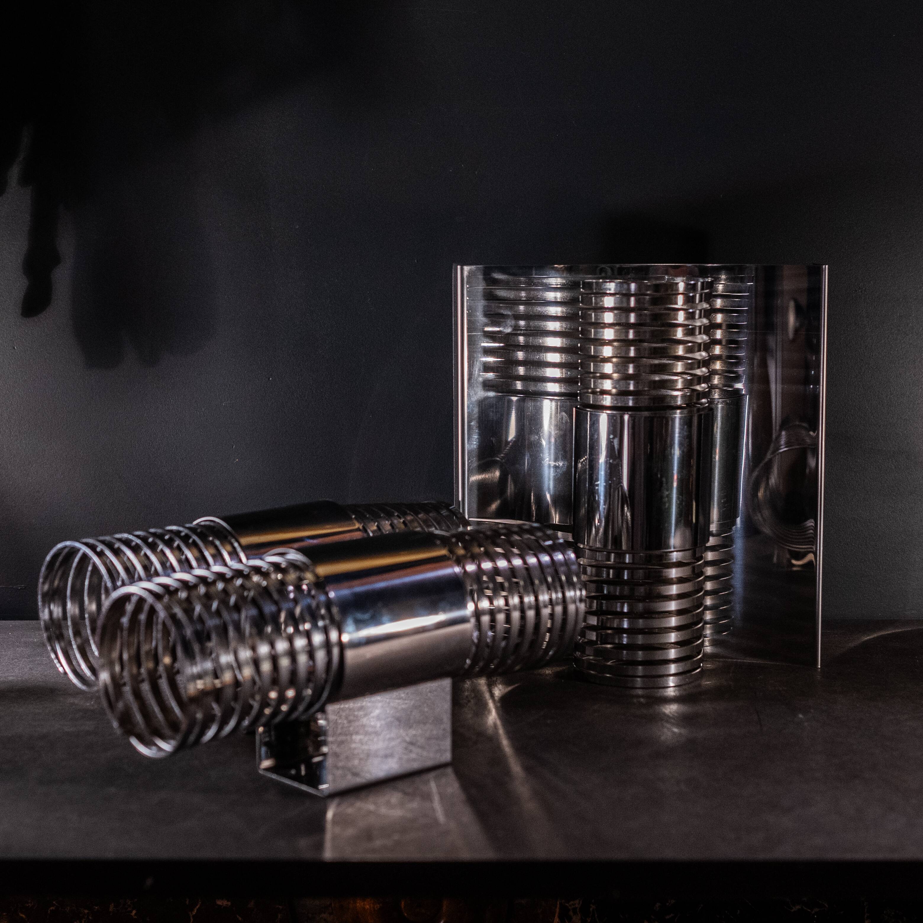 Pair of 'Spiral / Spring' wall lights in chromed steel, Space Age ca 1970