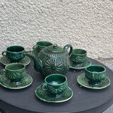 Service to the ceramic enamelled chiseled green and vintage