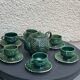Service to the ceramic enamelled chiseled green and vintage