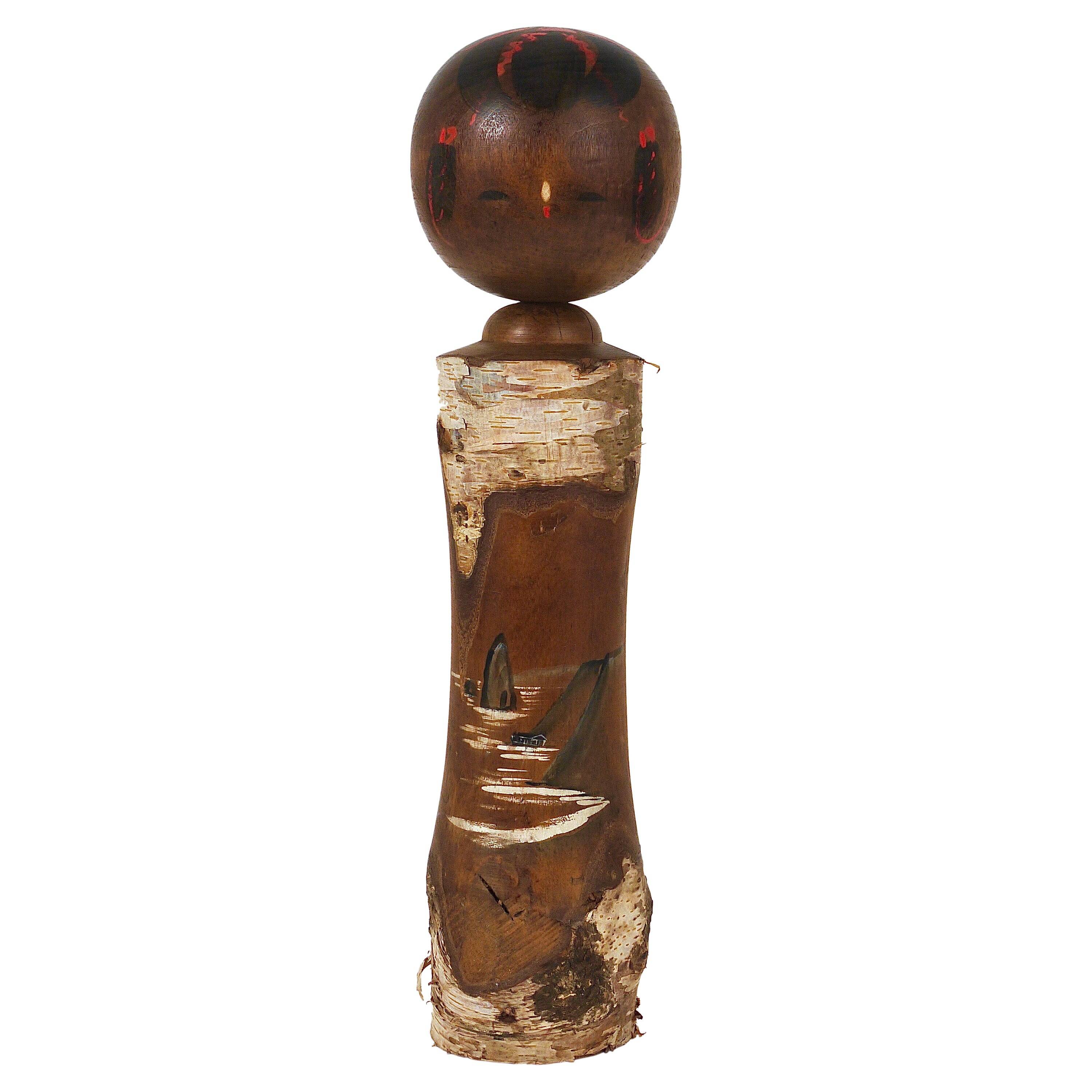 Decorative Kokeshi doll sculpture from northern Japan, hand-painted.