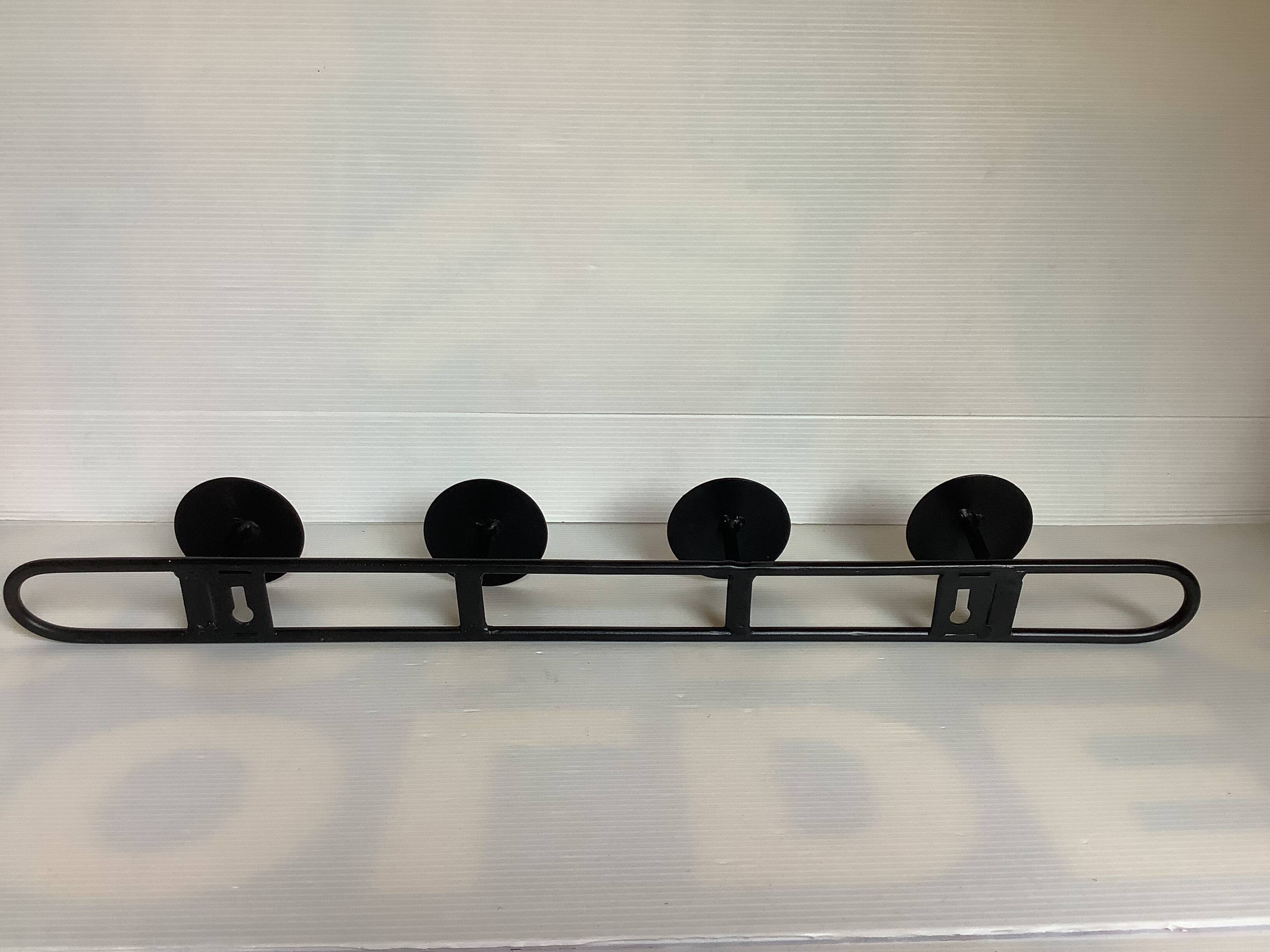 Green black metal coat rack with four hooks