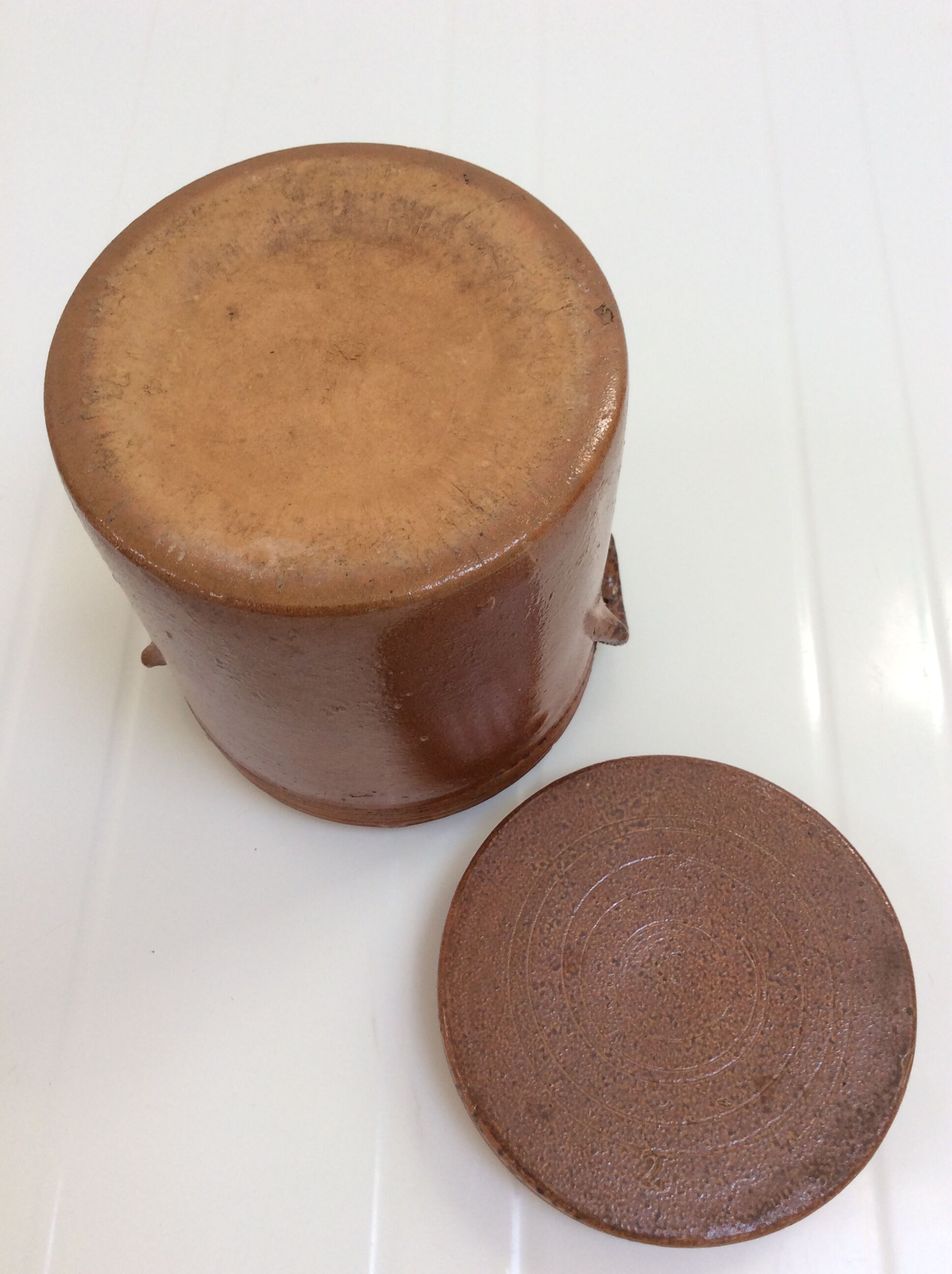 Old stoneware pot with lid