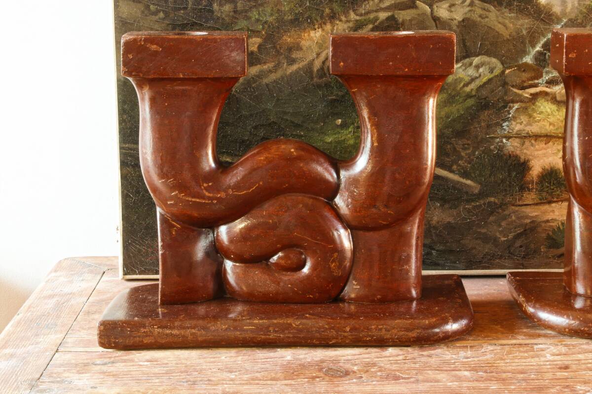 Pair of Art Deco carved wood candlesticks, signed Delaporte