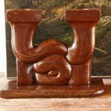 Pair of Art Deco carved wood candlesticks, signed Delaporte