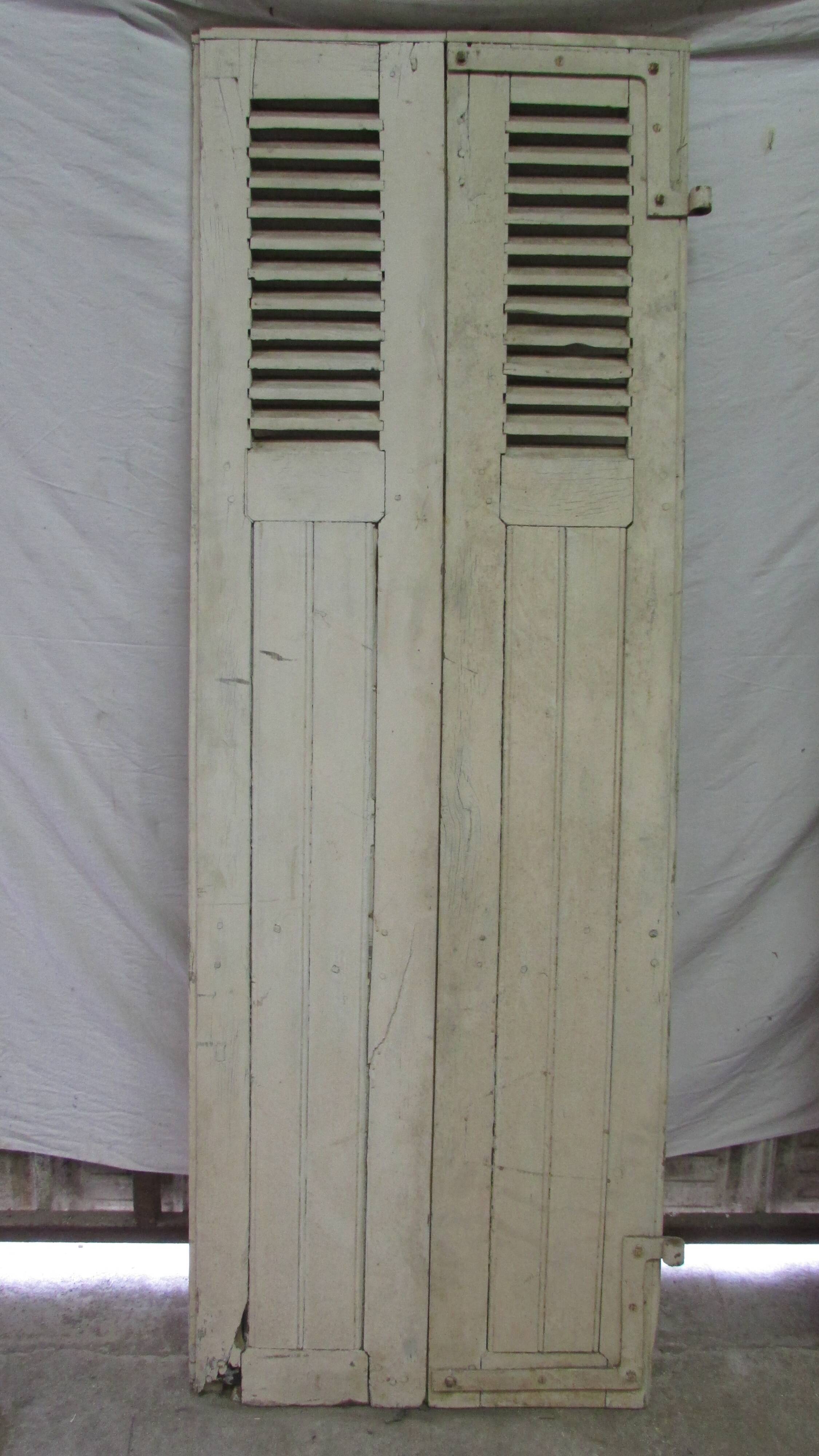 Old shutter in folding wooden louver