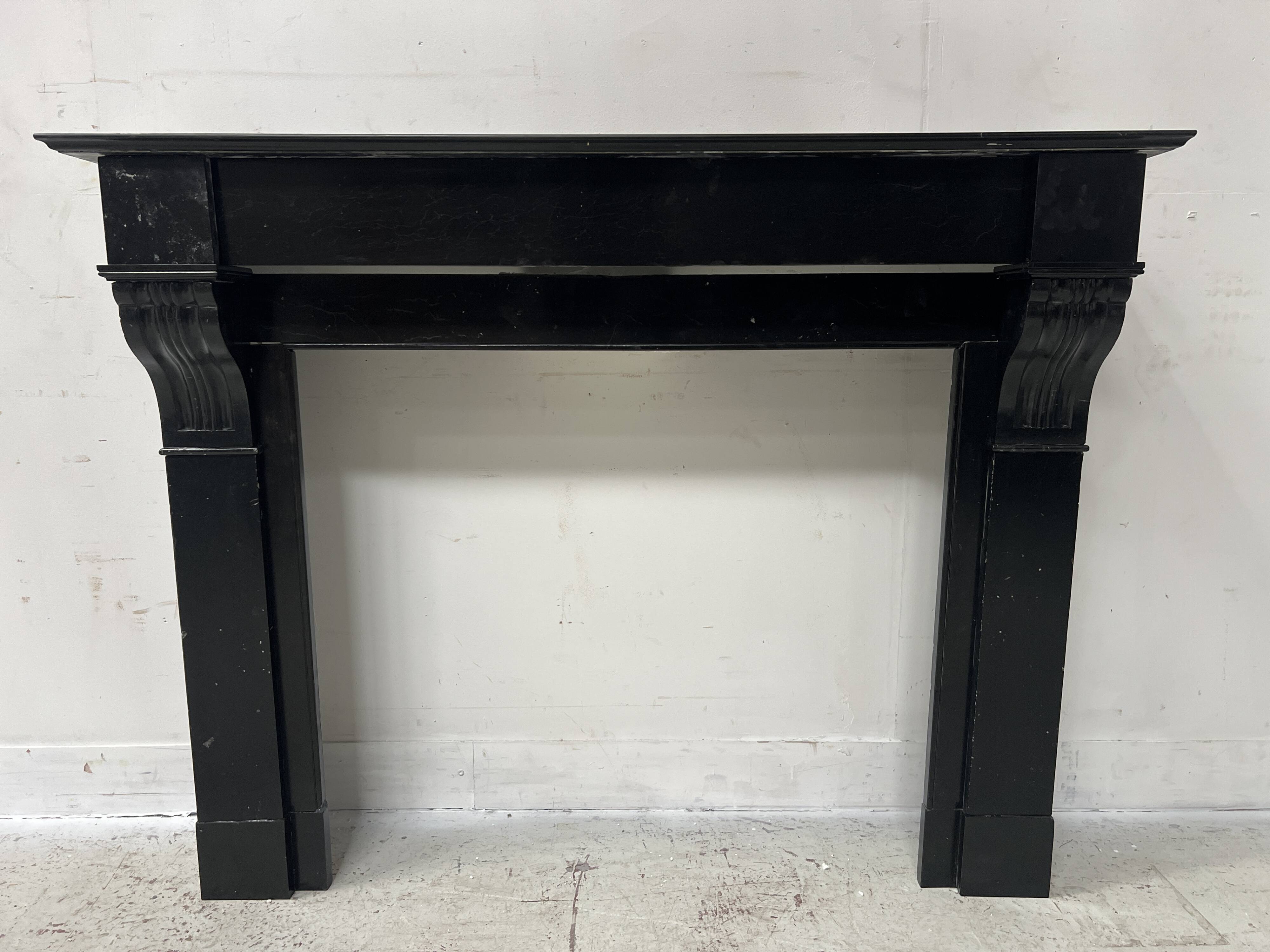 Napoleon III period fireplace with a black marble corbel. 19th century.