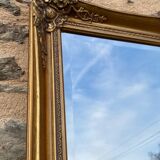 Grand miroir en bois sculpté doré