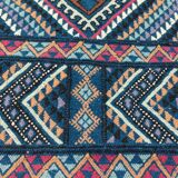 Blue carpet with multicolored patterns woven hands in natural wool