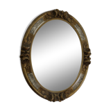 Oval wall mirror, golden floral pattern in stucco and wood, late 19th century