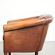 Vintage sheepskin club armchair finished with black piping