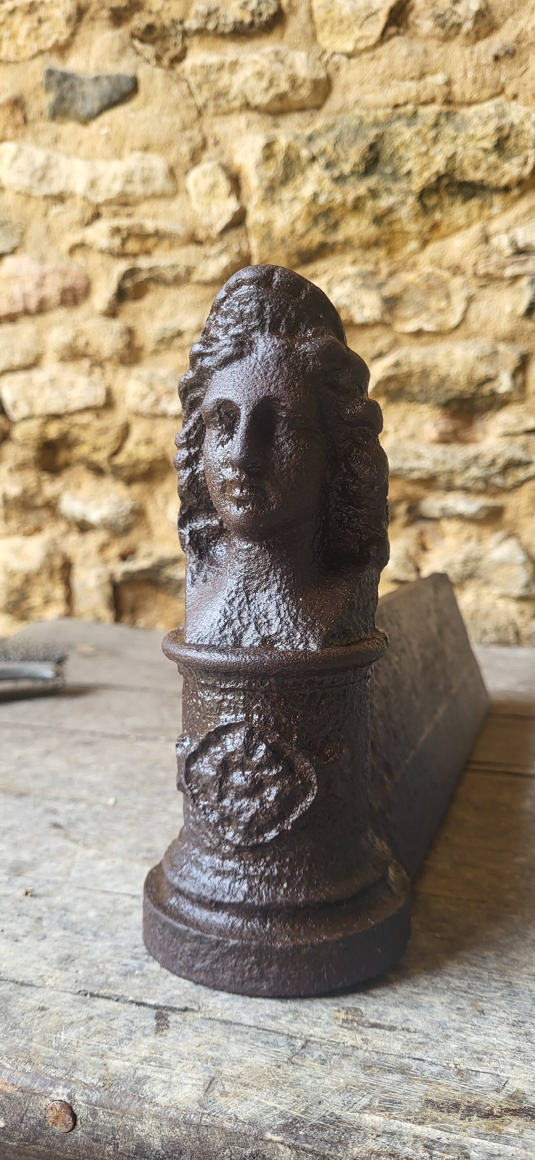 Pair of cast iron andirons from the 19th century