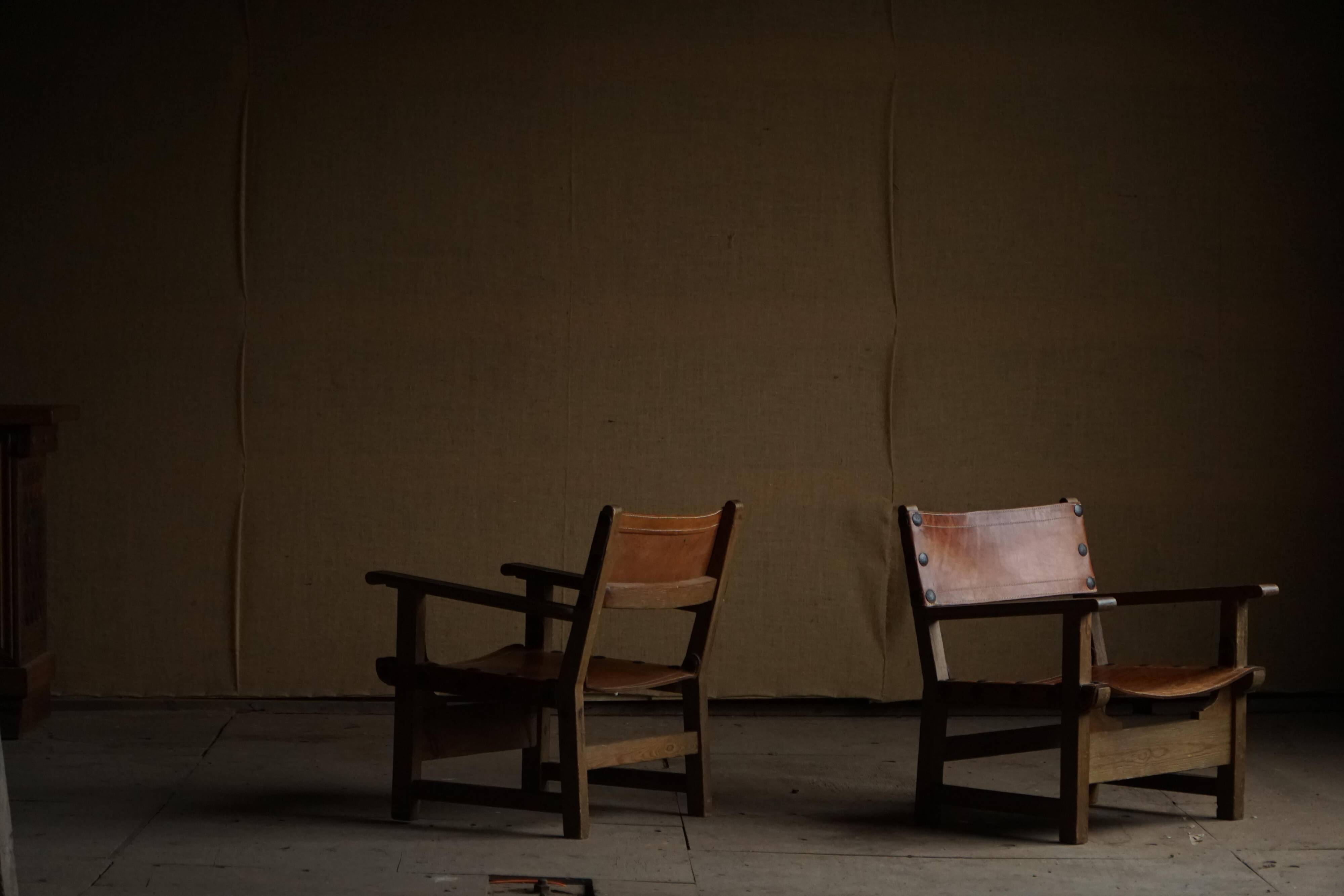 Pair of Spanish brutalist armchairs from the 1960s, wood and leather.