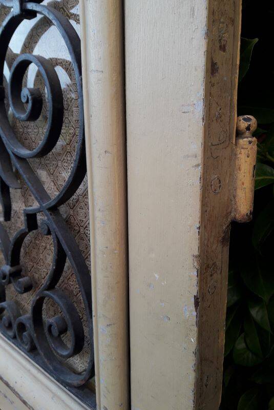 19th century double arched entrance door in oak with grilles and old glass