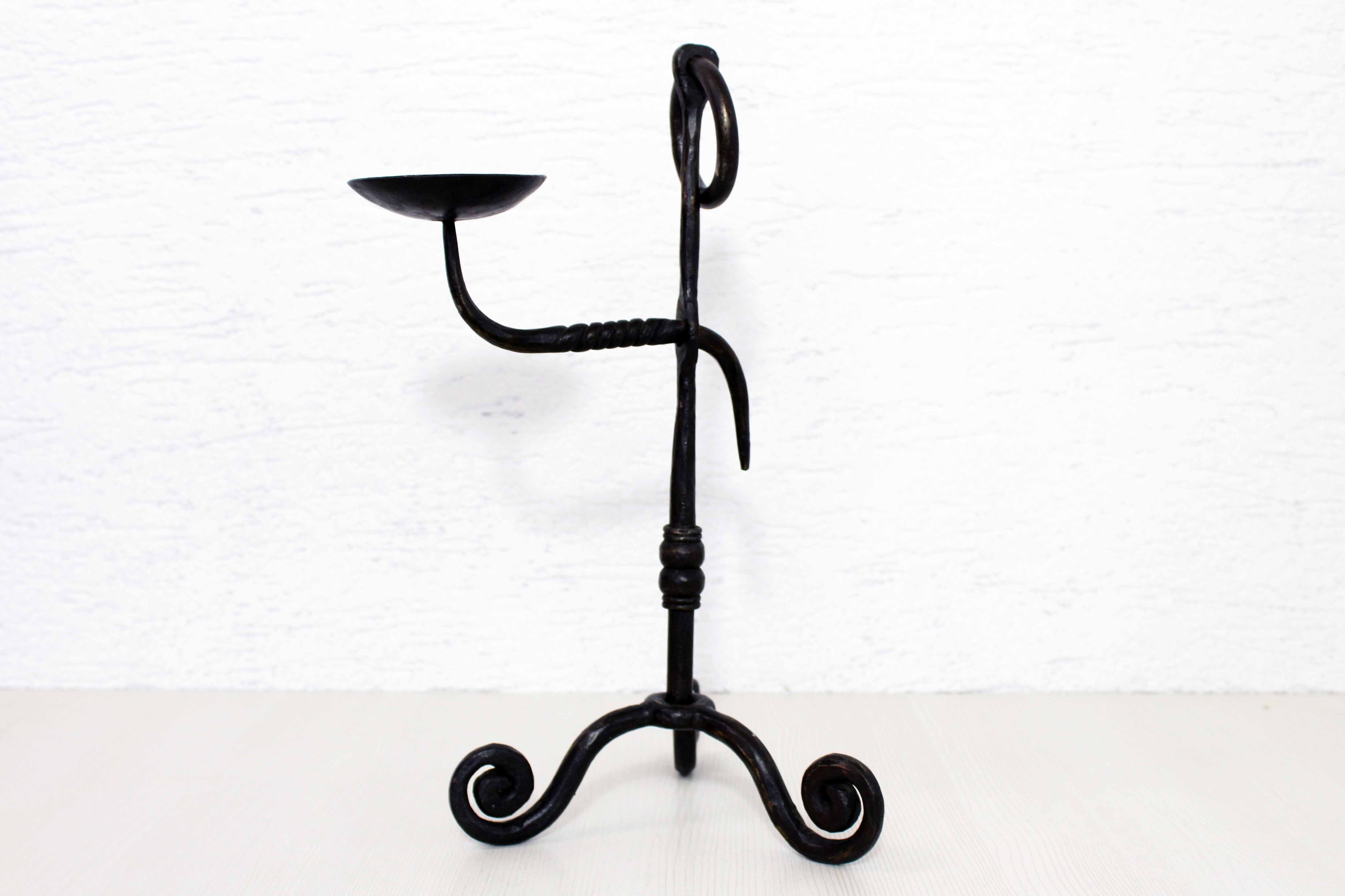 Antique iron candle holder