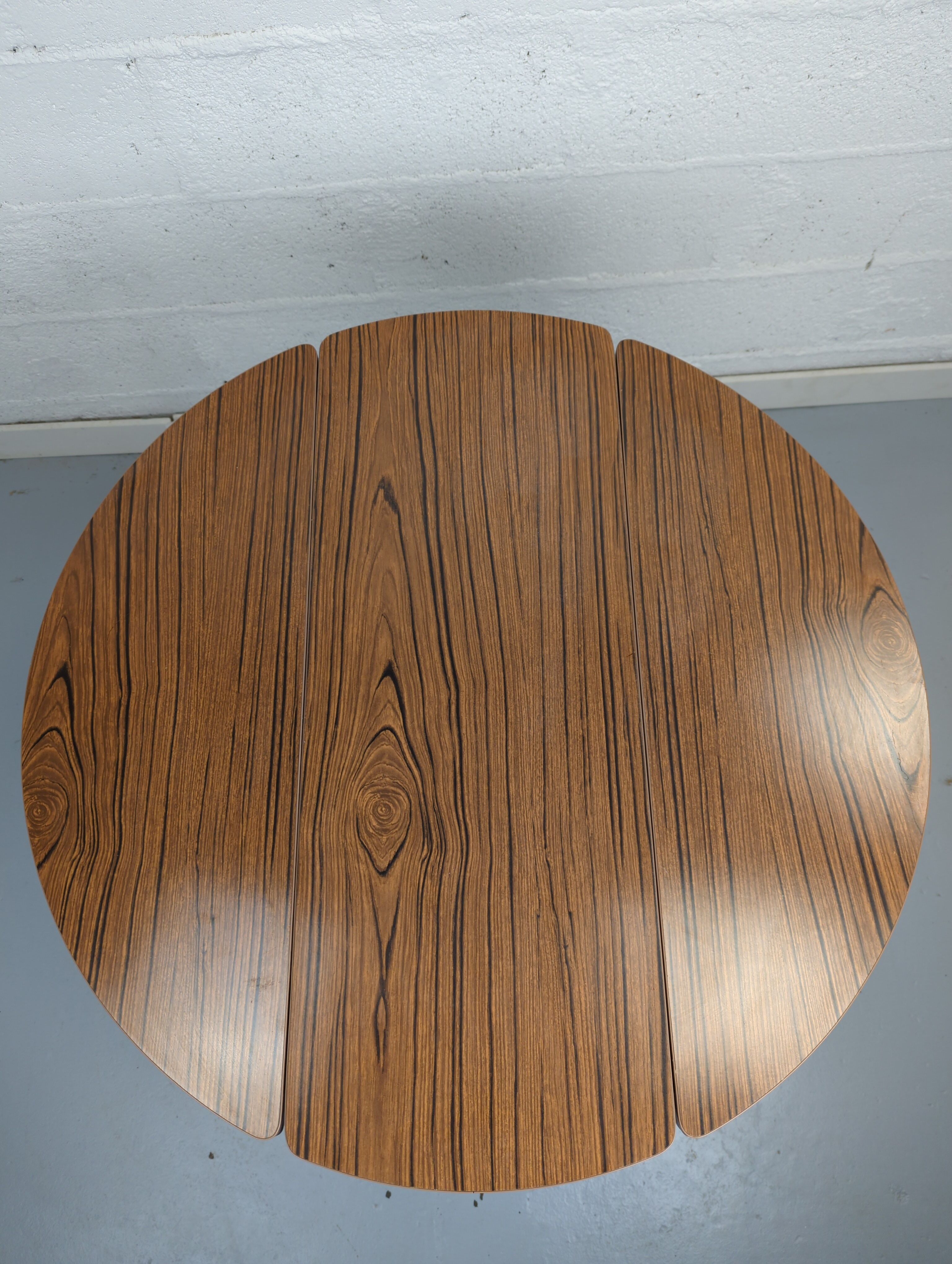 Foldable brown formica table compass legs