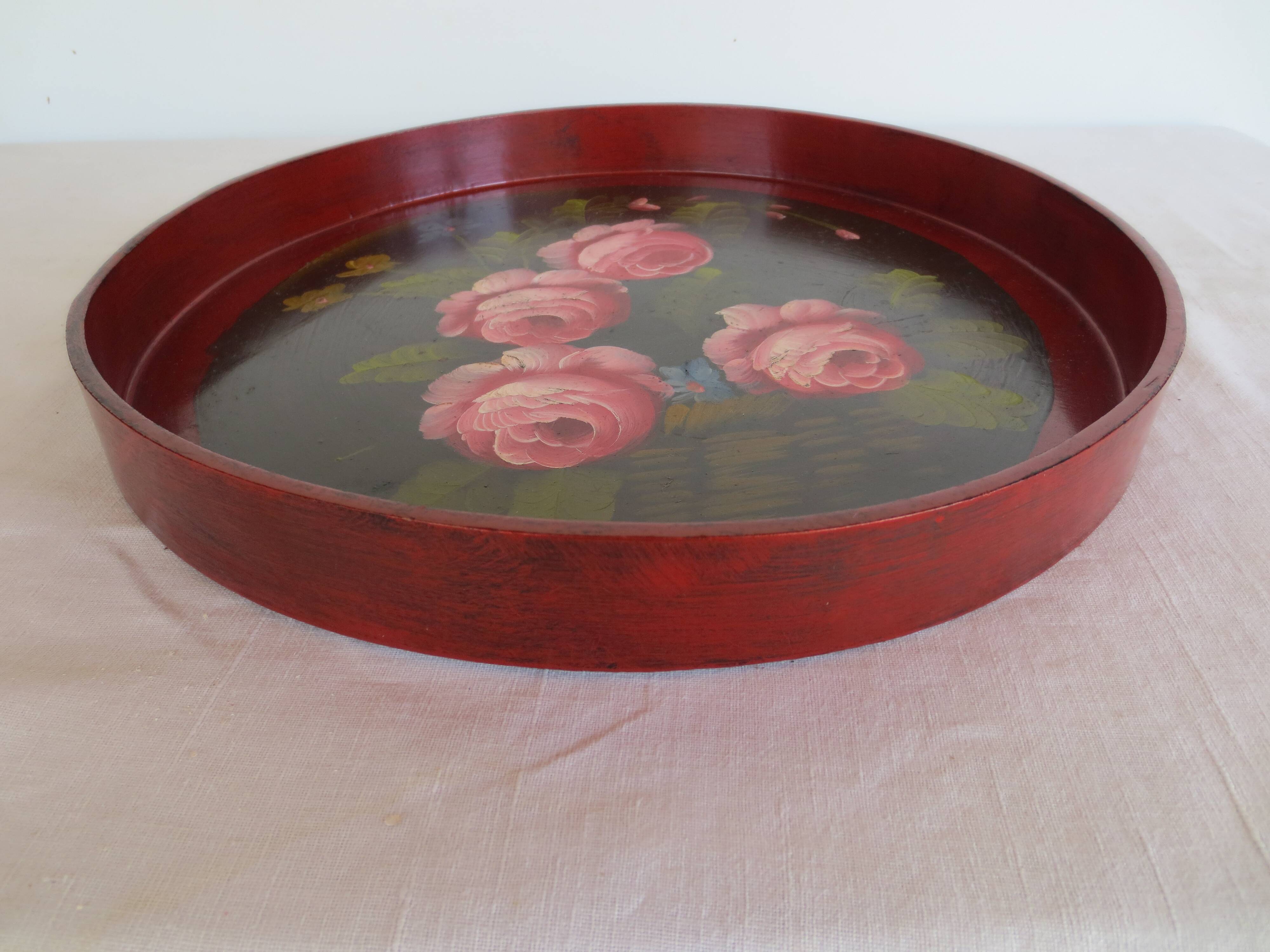 antique round wooden tray with rose decorations