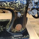 Old Singer sewing machine on pedestal
