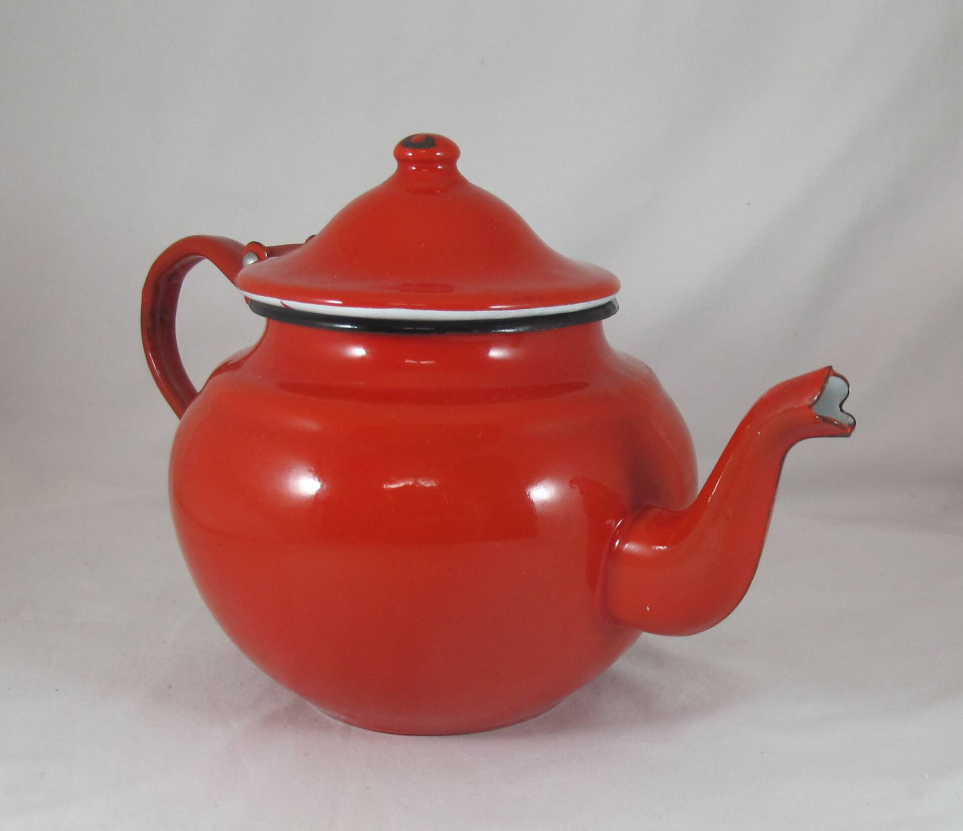 Vintage teapot coffee maker in red enameled metal