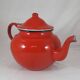 Vintage teapot coffee maker in red enameled metal