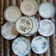 13 mismatched flat plates in ironstone