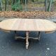 Extendable round farmhouse dining table restored in solid oak from the 19th century