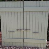 Pair of wooden shutters hanging iron