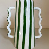 Green and white striped ceramic vase with abstract handmade corrugated handheld