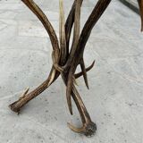 Vintage pedestal table from the 50s in vintage horns