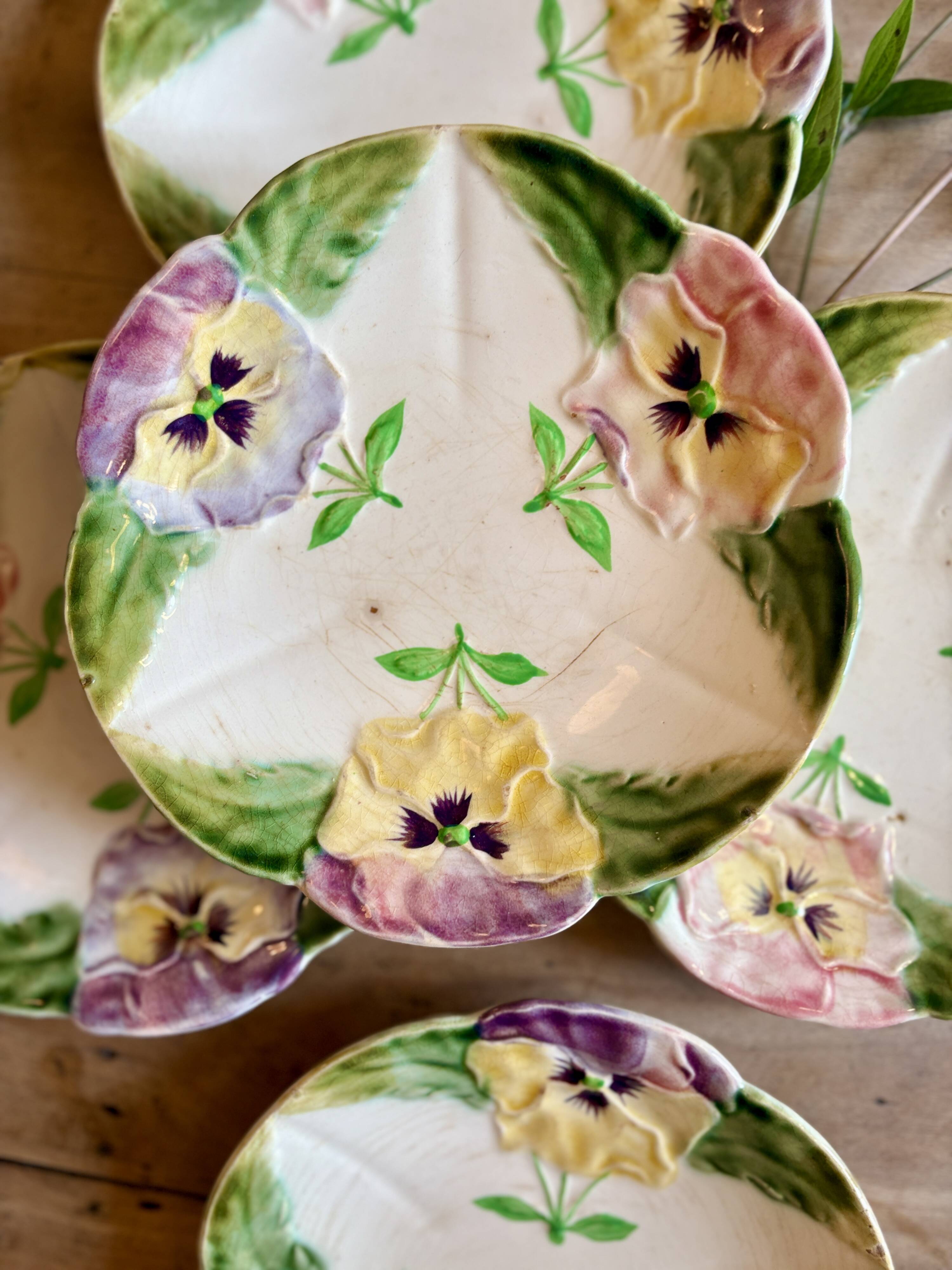 Set of 10 antique slip plates with flower decorations