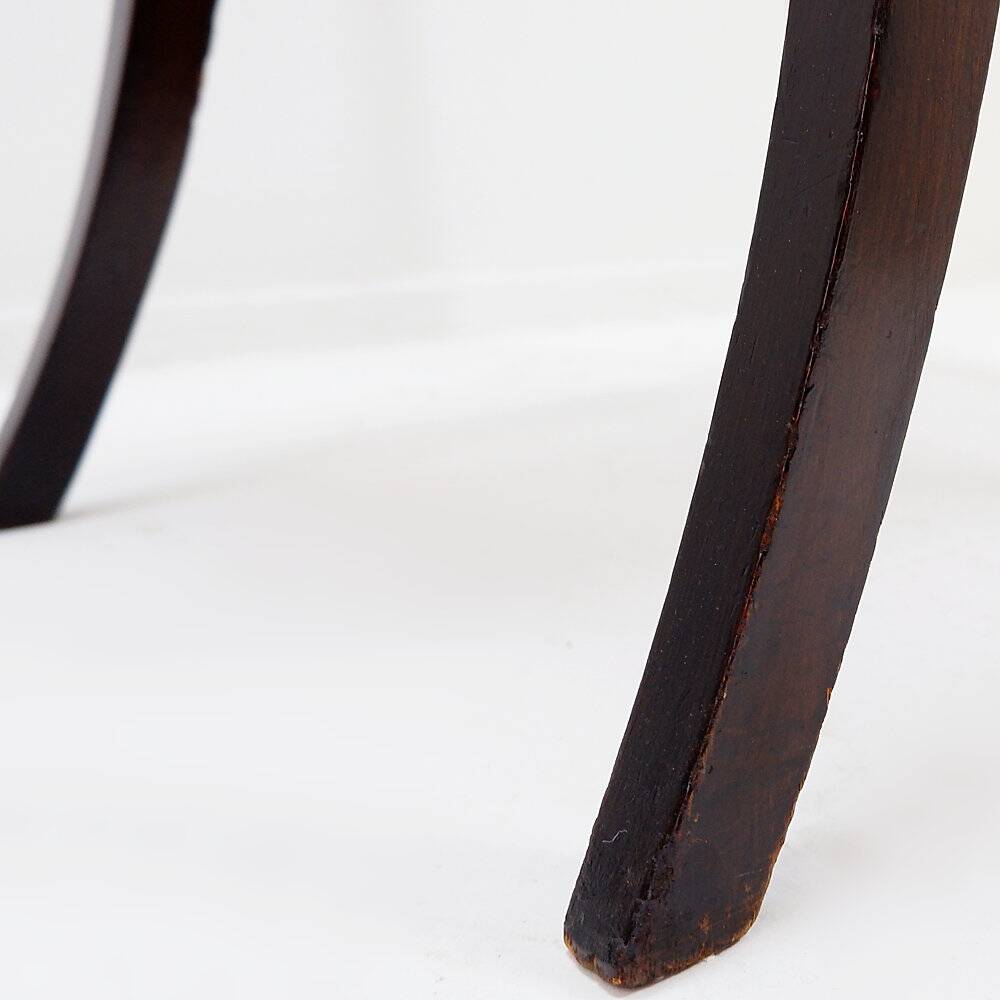 Mid-century curved wooden chairs with cane seats and backs.