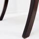 Mid-century curved wooden chairs with cane seats and backs.
