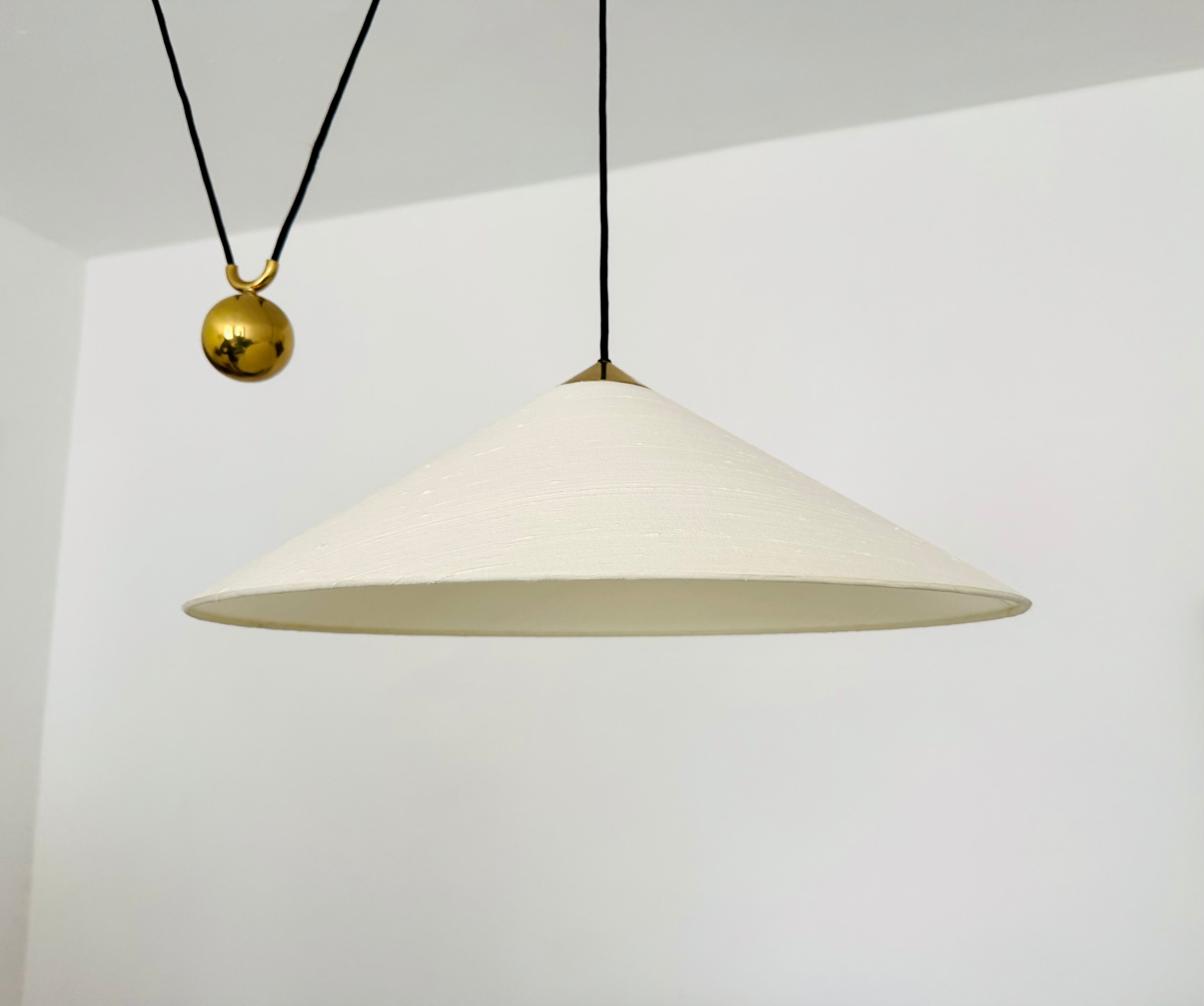 Large Adjustable Brass Pendant Lamp with Counterweight by Florian Schulz