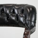 Adjustable black timeless Chesterfield office chair made of cow leather