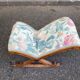 Kneeling prayer desk with rocking footrest in solid wood, curule style & floral fabric.