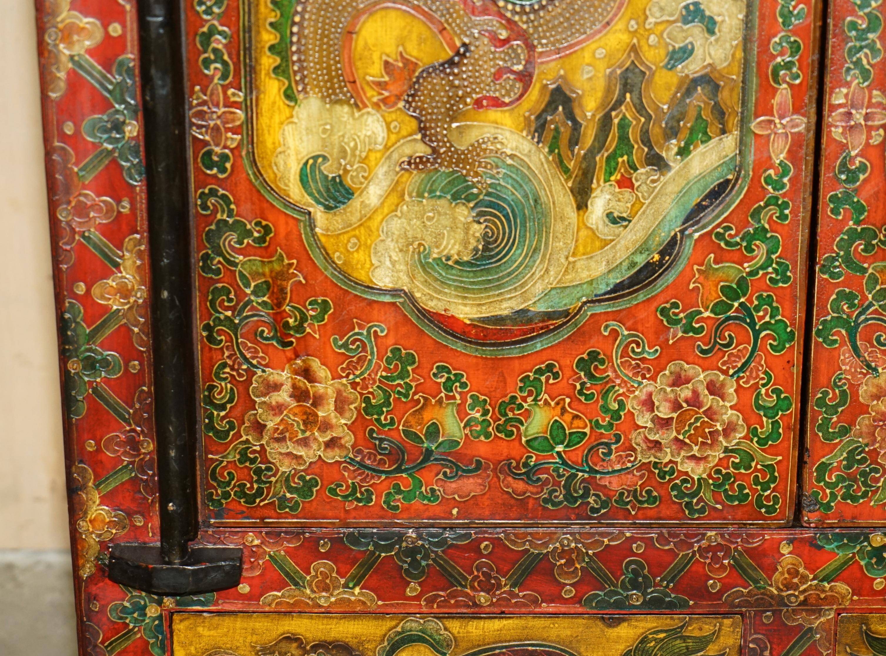 Vintage Chinese wardrobe painted with pagoda and drawers.