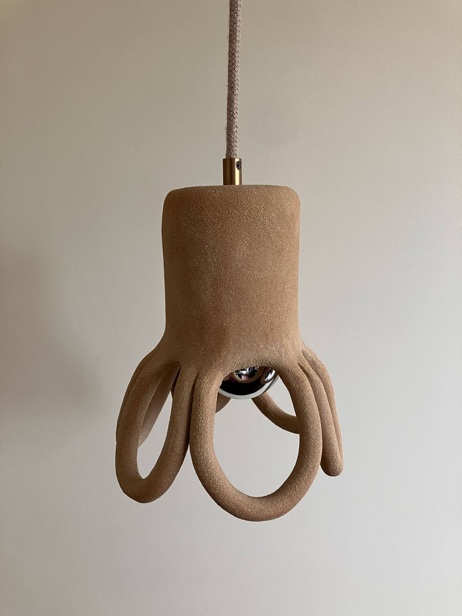 Suspension in the shape of a flower made of handcrafted ceramic, raw red stoneware mid-century.