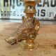 Vintage gold metal boar hunting candlestick
